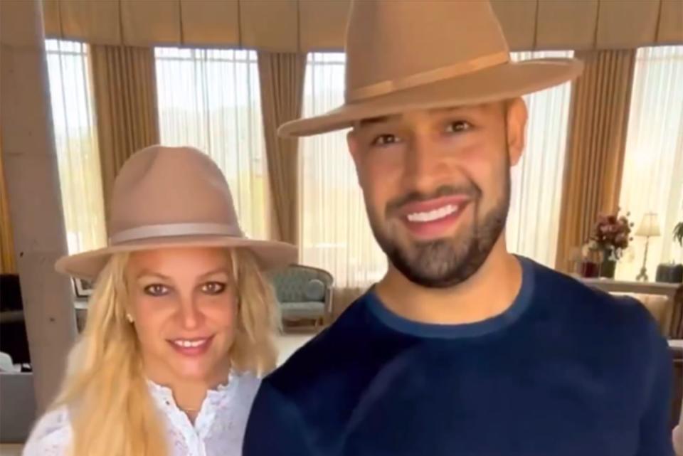<p>Britney Spears Instagram</p> Britney Spears and Sam Asghari wear matching hats in a new video posted by the pop star.