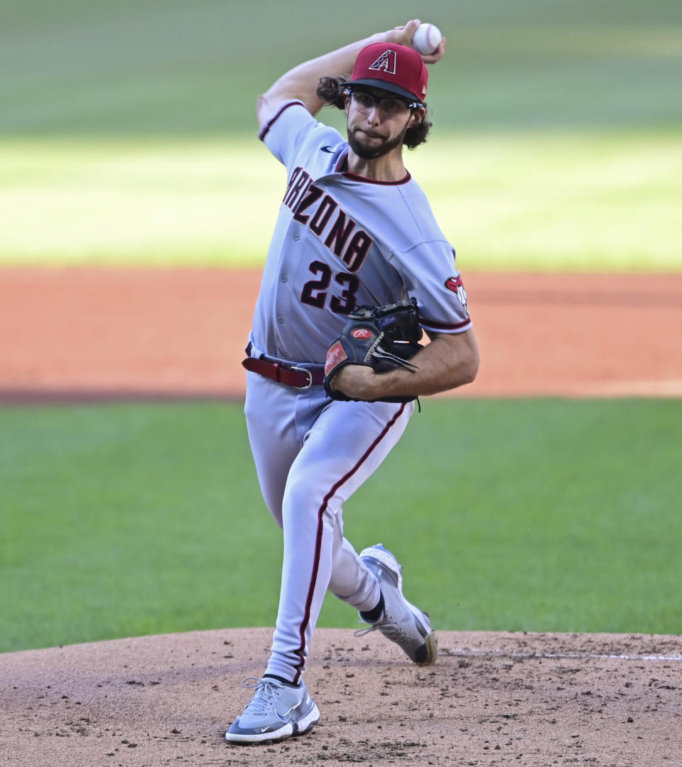 Arizona Diamondbacks starting pitcher Zac Gallen delivers during the first inning of the team's baseball game against the Cleveland Guardians, Tuesday, Aug. 2, 2022, in Cleveland. (AP Photo/David Dermer)