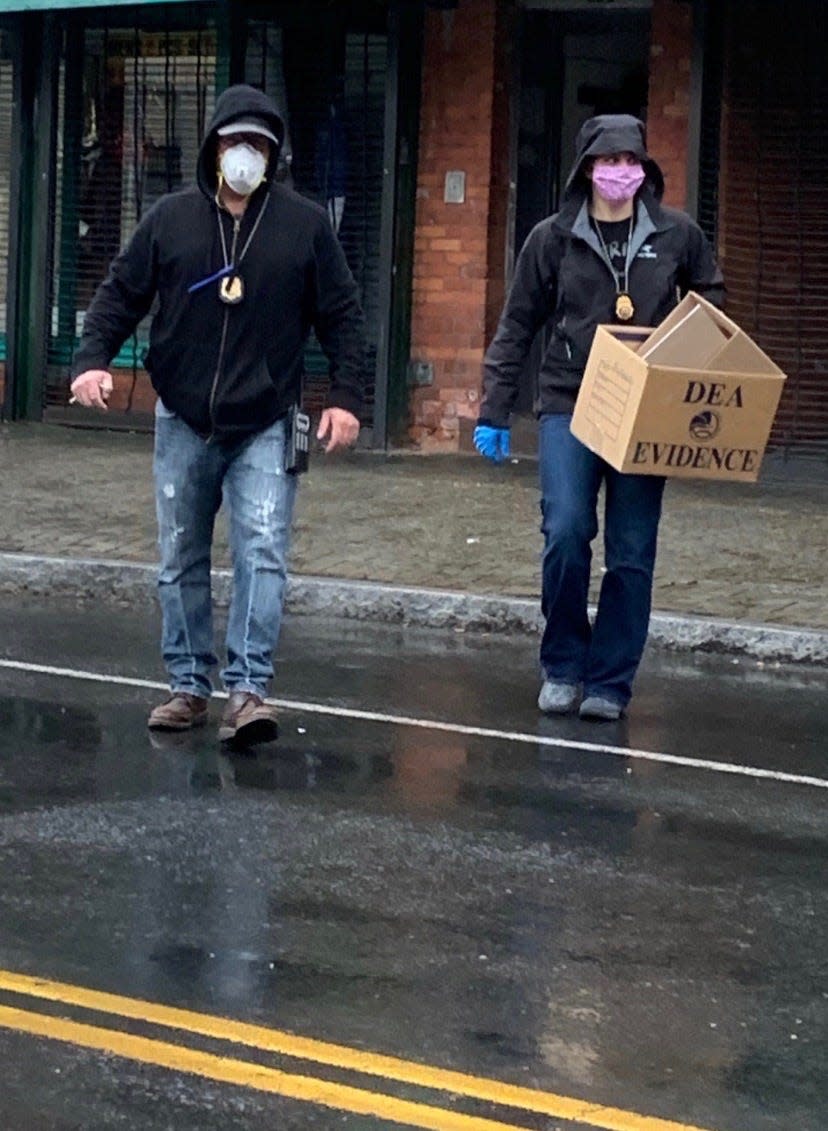 Drug agents with the DEA's New England Division take precautions against the COVID-19 virus during a recent investigation.