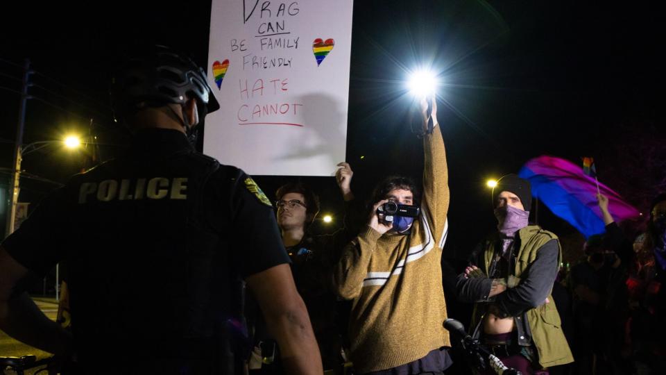 People rally in support of drag performances after protesters gathered outside an 