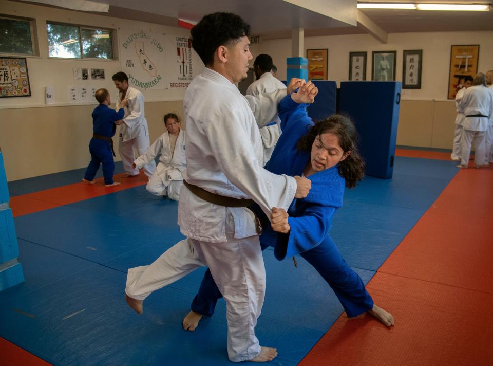 Joseph Hernandez, left, grapples with Alejandra Ochoa during a practice of the Stockton Judo Club at the McKinley Park Community Center in south Stockton.