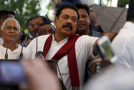 Former Sri Lankan president Mahinda Rajapaksa speaks to his supporters at his residence in Medamulana July 1, 2015. REUTERS/Dinuka Liyanawatte