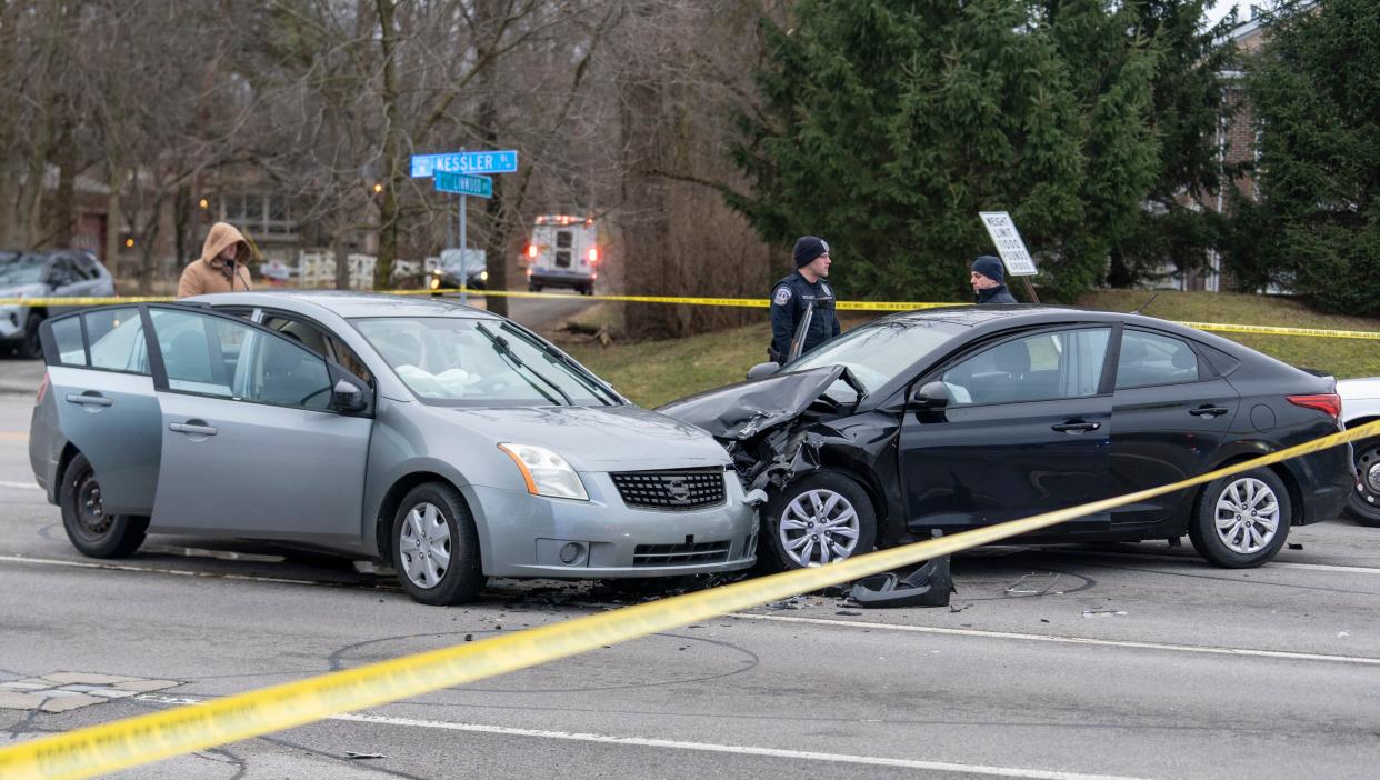 Two cars at the scene of an incident at the corner of Binford Blvd., and Kessler Blvd. East Drive. Early reports indicated that IMPD attempted to pull over a vehicle at 38th and Binford, a police chase ensued, then shots were exchanged between at least one person and IMPD officers after a foot chase. It is unknown whether these cars were involved in the chase. 