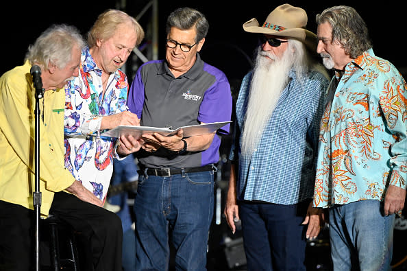 LOUISVILLE, KENTUCKY – AUGUST 20: Joe Bonsall, Duane Allen, William Lee Golden, and Richard Sterban of the Oak Ridge Boys signs on for another year with David S. Beck (C), President, CEO, Interim GM at KICC at the Kentucky State Fair on August 20, 2023 in Louisville, Kentucky. (Photo by Sarah Anne Cohen/WireImage)