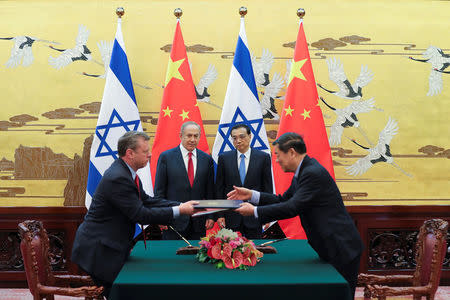 Chinese Premier Li Keqiang with Israel Prime Minister Benjamin Netanyahu attend a signing ceremony at the Great Hall of the People in Beijing, China March 20, 2017. REUTERS/Lintao Zhang/Pool
