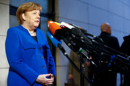 Acting German Chancellor Angela Merkel arrives for exploratory talks about forming a new coalition government at the SPD headquarters in Berlin, Germany, January 11, 2018. REUTERS/Hannibal Hanschke