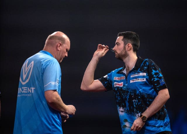 Luke Humphries (right) and Vincent van der Voort in action at the World Championship