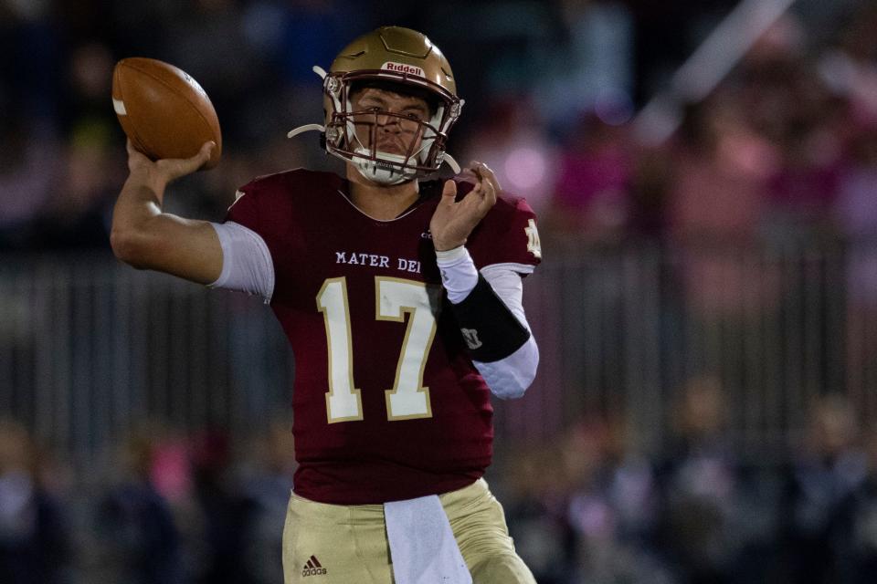 Mater Dei's Mason Wunderlich (17) passes as the Reitz Panthers play the Mater Dei Wildcats for the West Side Nut Club trophy at the Reitz Bowl in Evansville, Ind., Friday evening, Oct. 14, 2022.