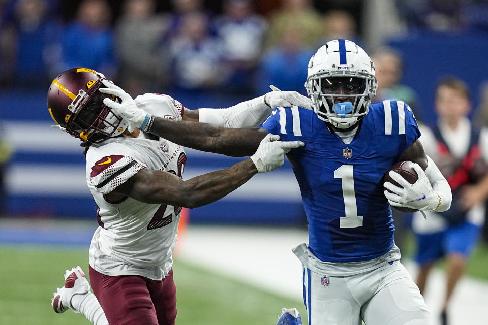 Indianapolis Colts wide receiver Parris Campbell (1) pushes off Washington Commanders safety Darrick Forrest (22) in the second half of an NFL football game in Indianapolis, Fla., Sunday, Oct. 30, 2022. (AP Photo/Darron Cummings)