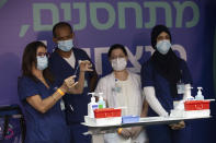 Medical staff prepare COVID-19 vaccines for Israeli President Isaac Herzog and his wife at the Sheba Medical Center in Ramat Gan, Israel, Friday, July 30, 2021. (AP Photo/Maya Alleruzzo, Pool)