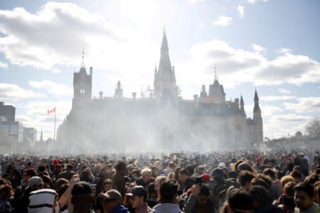 Smoke rises during the annual 4/20 marijuana rally on Parliament Hill in Ottawa, Ontario, Canada, April 20, 2018. REUTERS/Chris Wattie