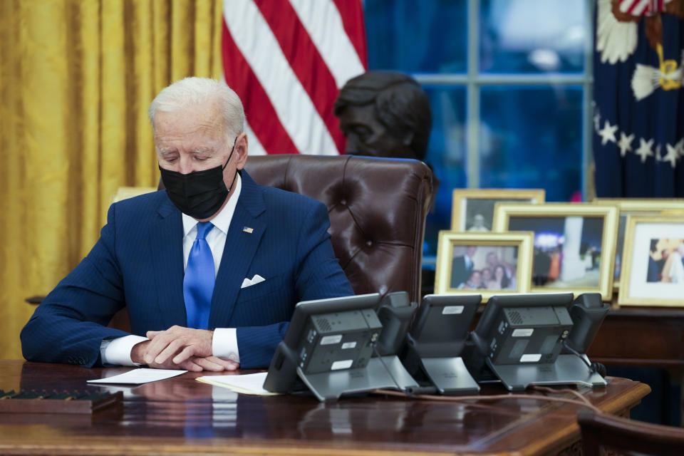 President Joe Biden signs executive orders. Photo: Doug Mills/Pool/Sipa USA