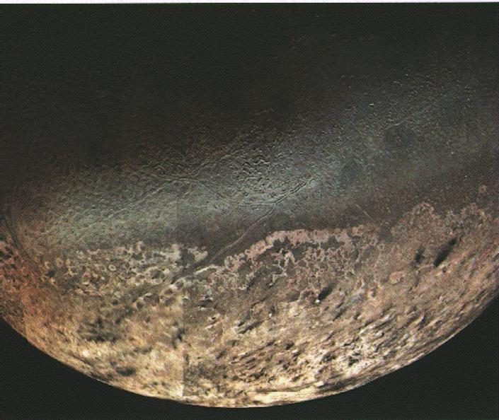 A picture shows Triton's rough surface.