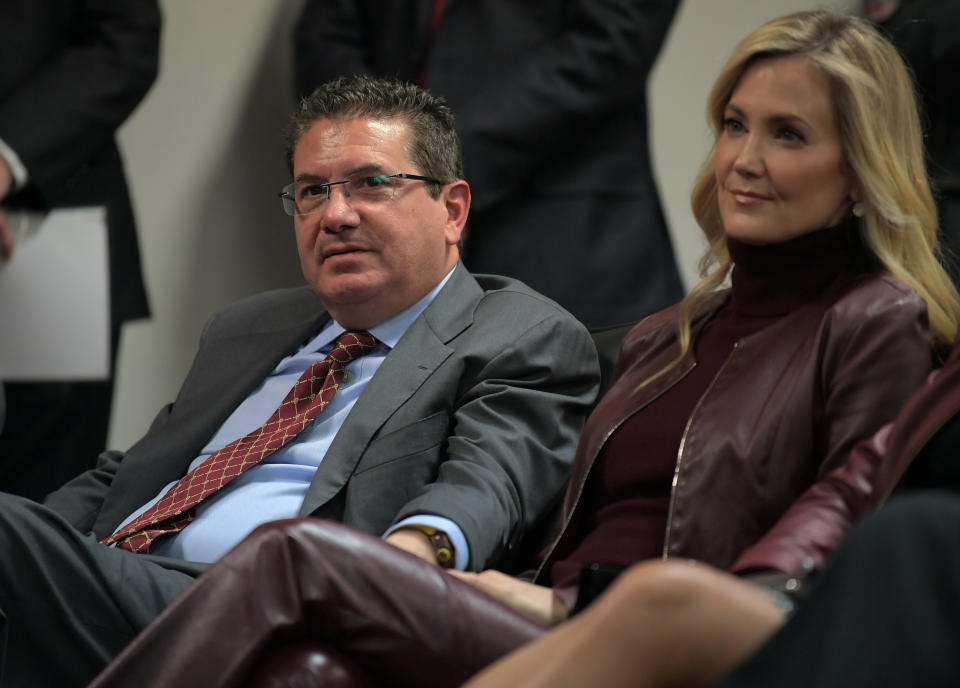 ASHBURN, VA - JANUARY 2: Washington Redskins owner Dan Snyder sits with his wife, Tanya Snyder, missing the crowd as Ron Rivera is introduced as the new head coach of the Washington Redskins at a press conference at Redskins Park in Ashburn, Virginia on January 2, 2020. (Photo by John McDonnell/The Washington Post via Getty Images)