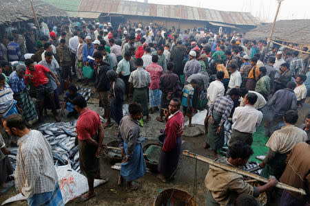 Rohingya men are pictured at a fish market in Sittwe in the state of Rakhine, Myanmar March 2, 2017. REUTERS/Soe Zeya Tun