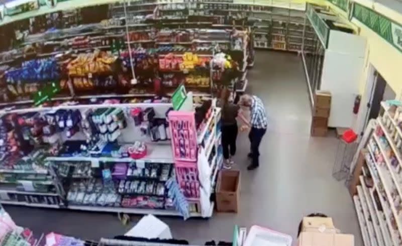 Man, identified by police as Gomoll, appears to wipe his nose and face on the shirt of a Dollar Tree store employee