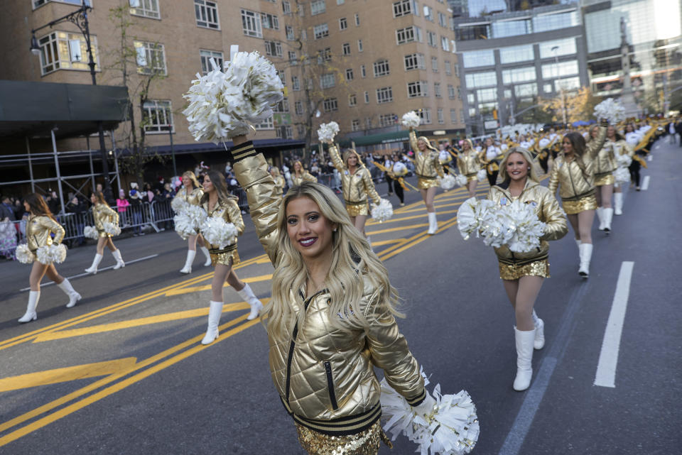 Cheerleaders from the University of Missouri marching band walk down Central Park South during the Macy's Thanksgiving Day Parade, Thursday, Nov. 24, 2022, in New York. (AP Photo/Jeenah Moon)
