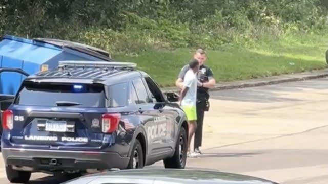 Kenosha police arresting a young black man