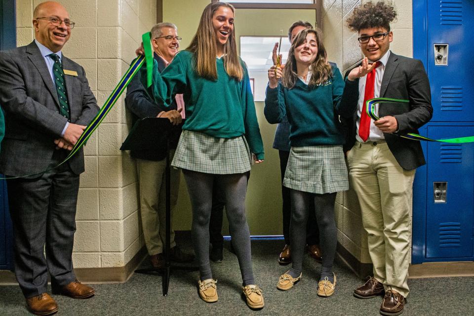 Saint Mark's High School students cut the ribbon at the opening of Sean's Room at Saint Mark's in Pike Creek on Friday, Feb. 24, 2023. In partnership with SL24: Unlocke the Light Foundation and Sean's House, Sean's Room is an offshoot of Sean's House designed to address mental health concerns and provide resources for Spartan students.