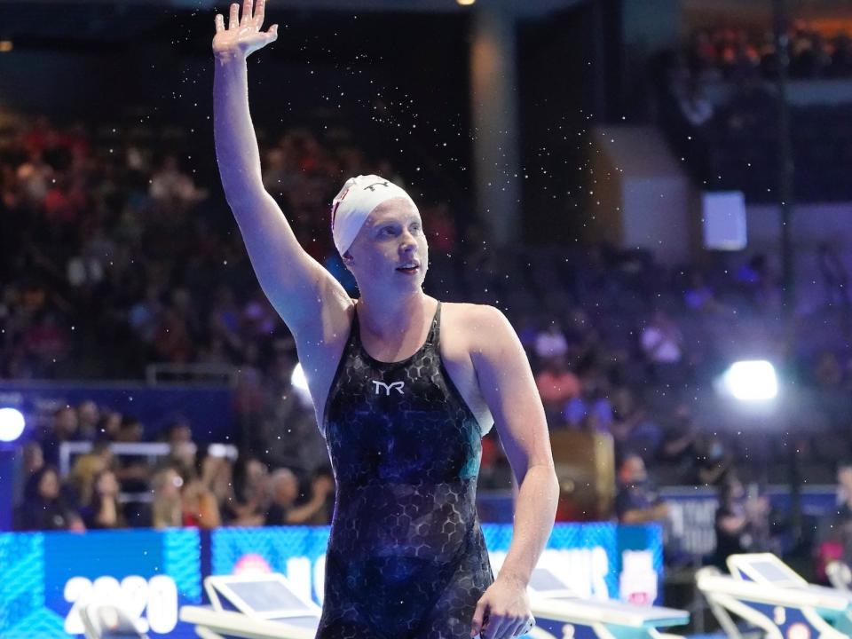 Lilly King waves at the 2021 Olympic trials.