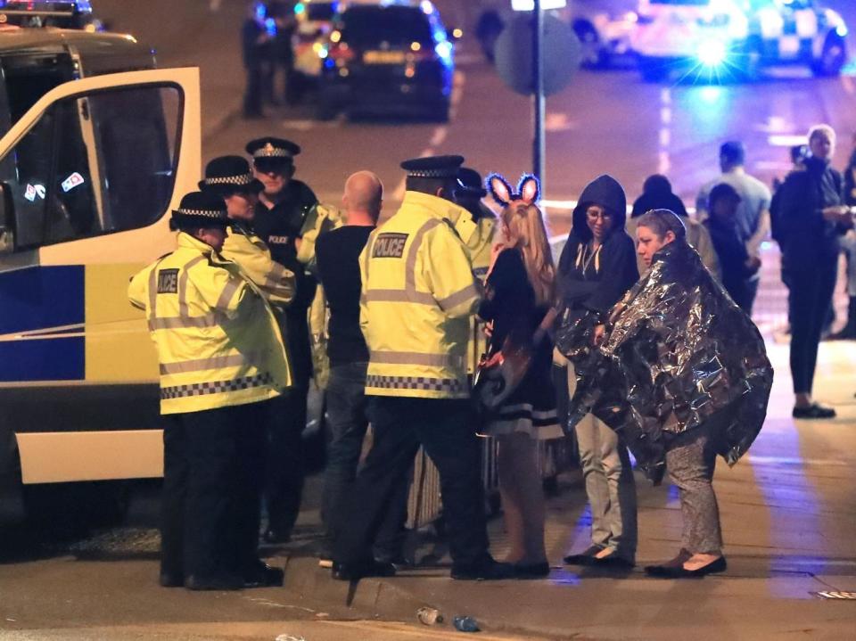 Survivors outside the arena after the attack (PA)