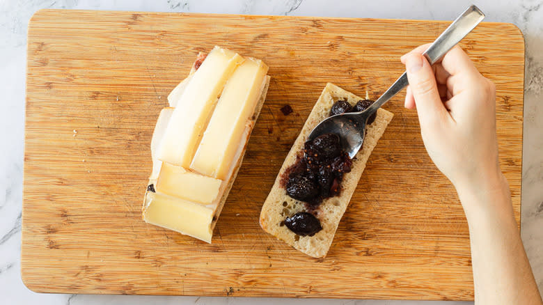 Adding chutney to bread half