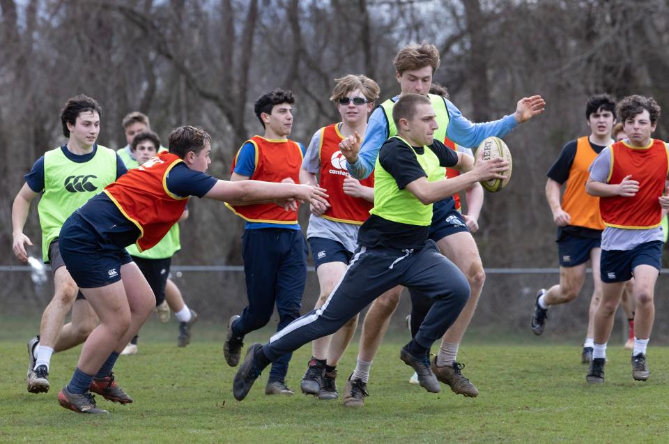CBA Kyle Krebs avoids the tag during a game of sevens. Christian Brothers Academy Rugby team practices as they prepare for a 10 day trip to Ireland over Spring Break. Practice was in Lincroft on May 28, 2023. 