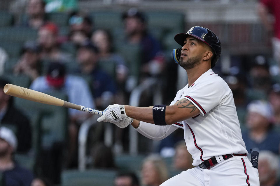 Atlanta Braves' Eddie Rosario watches his two-run home run against the New York Yankees during the second inning of a baseball game Wednesday, Aug. 16, 2023, in Atlanta. (AP Photo/John Bazemore)