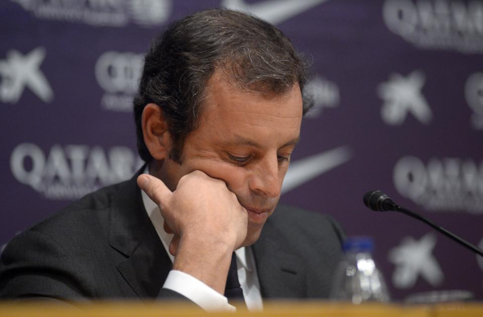 FC Barcelona's president Sandro Rosell, looks down during a press conference at the Camp Nou stadium in Barcelona, Spain, Thursday, Jan 23, 2014. Sandro Rosell is stepping down as president of Barcelona a day after a judge agreed to hear a lawsuit accusing him of allegedly hiding the cost of the transfer of Brazil striker Neymar. Rosell says he is resigning after an emergency meeting with Barcelona's board of directors on Thursday. Rosell says vice president Josep Bartomeu will take his place as president and finish the term that expires in 2016. Elected in 2010 to replace outgoing president Joan Laporta, Rosell said last April he planned to run for re-election in 2016. (AP Photo/Manu Fernandez)