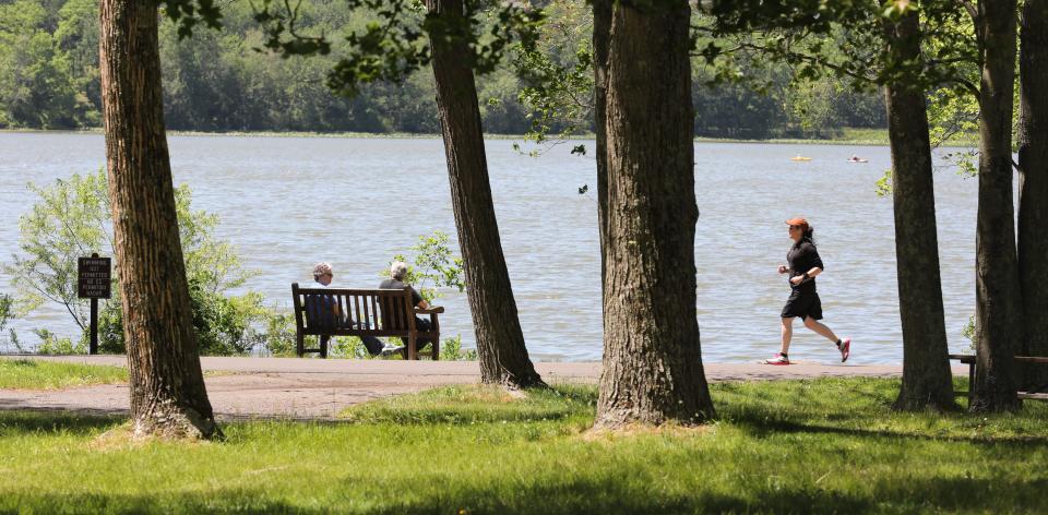 A runner enjoys the trail around Rockland Lake State Park in Valley Cottage, May 27, 2021. 