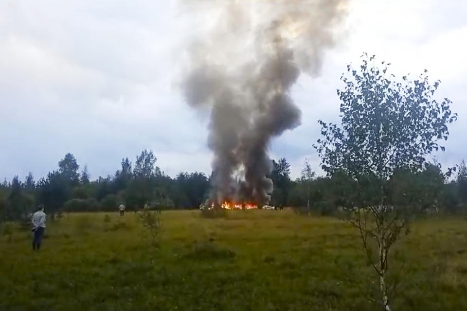 FILE - In this image taken from video, smoke rises from the crash of a private jet near the village of Kuzhenkino in the Tver region of Russia, on Aug. 23, 2023. Prigozhin's uprising marked the most serious challenge to Russian President Vladimir Putin's rule in his more than two decades in power and badly dented his authority. President Vladimir Putin is likely to win another six-year term easily in an election expected in March, using his sweeping grip on Russia’s political scene to extend his tenure of over two decades in power. (AP Photo/File)