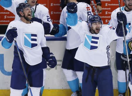 Sep 25, 2016; Toronto, Ontario, Canada; Team Europe forward Tomas Tatar (right) and defence Dennis Seidenberg (left) react after the official review of forward Tatar's game winning goal is confirmed during a semifinal game against Team Sweden in the 2016 World Cup of Hockey at Air Canada Centre. Team Europe defeated Team Sweden 3-2 in overtime. Mandatory Credit: John E. Sokolowski-USA TODAY Sports