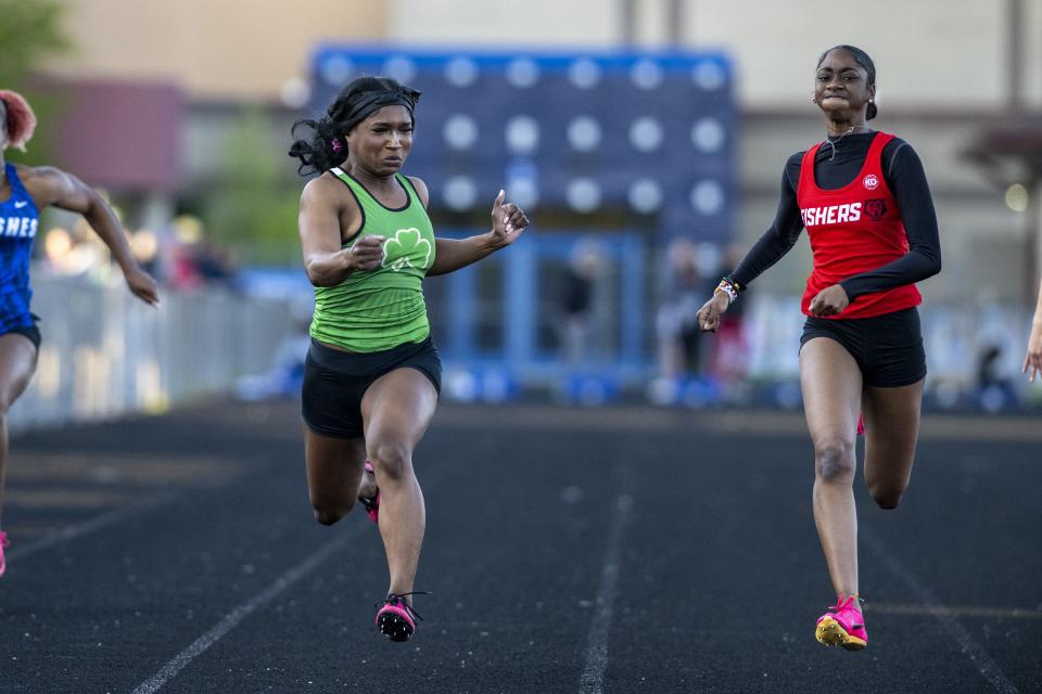 Fishers High School junior Maya Taylor, right, edges out Westfield High School senior Princess Campbell to win the 100m Dash during a Hoosier Crossroad Conference girlsâ€™ track meet, Wednesday, May 3, 2023, at Hamilton Southeastern High School.