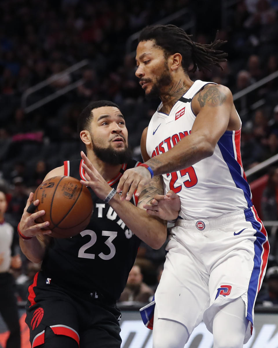 Toronto Raptors guard Fred VanVleet (23) is defended by Detroit Pistons guard Derrick Rose (25) during the first half of an NBA basketball game Friday, Jan. 31, 2020, in Detroit. (AP Photo/Carlos Osorio)