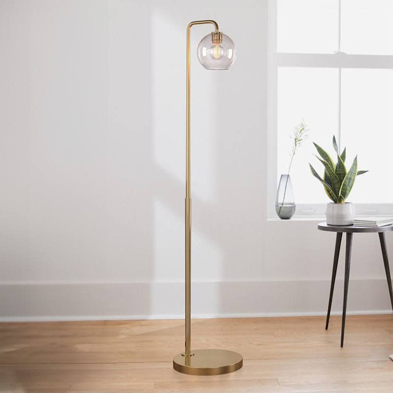 Floor lamp made of carved glass in the shape of a ball