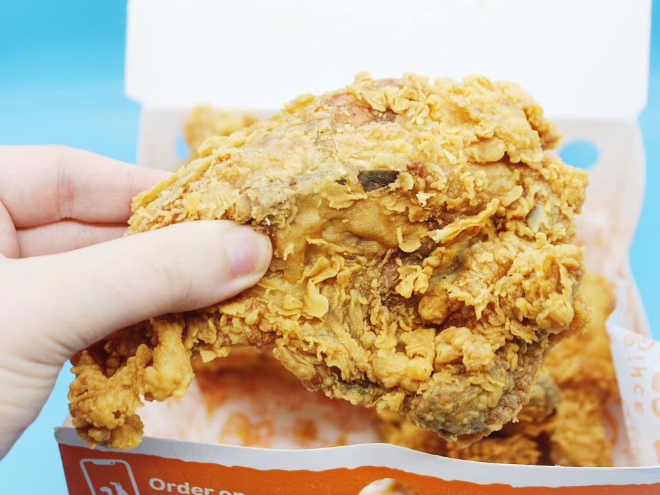 popeyes box with fried chicken leg