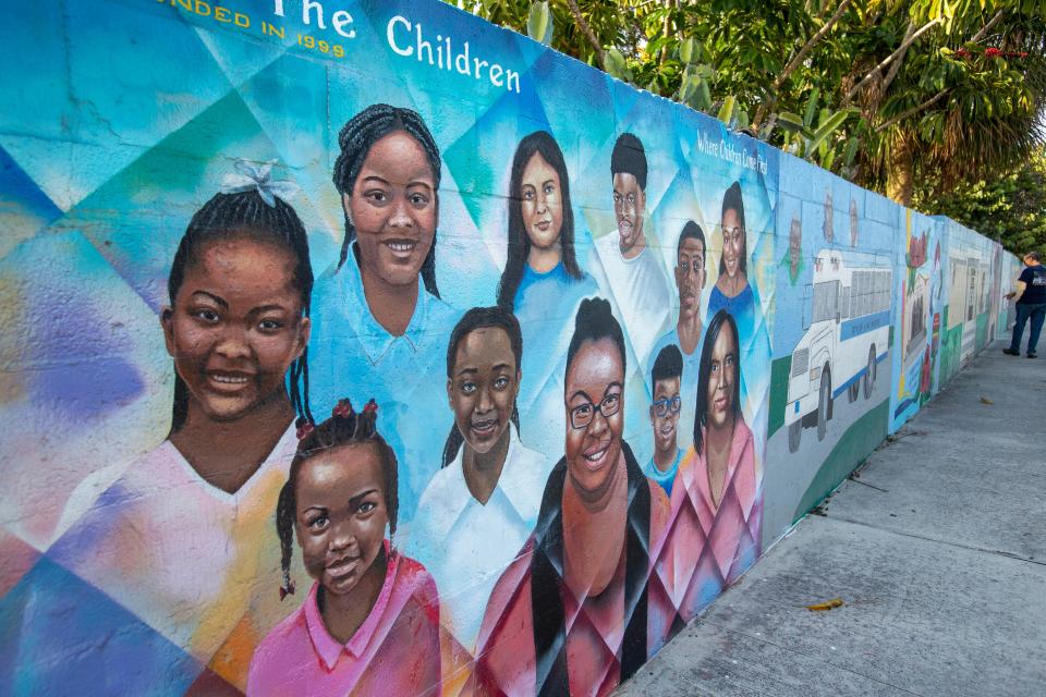 Murals painted along the Wall of Unity in Lake Worth Beach, Florida on January 10, 2024. The 1,100-foot wall at the southern end of Lake Worth Beach once separated the races in the city.