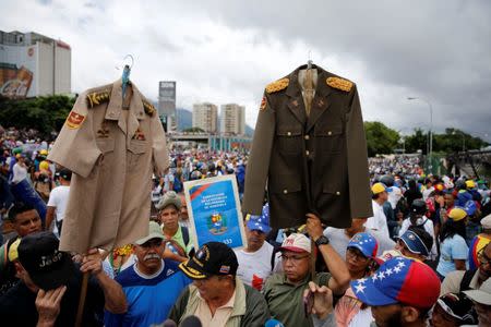 Demonstrators gather in front of a Venezuelan Air Force base while rallying against Venezuelan President Nicolas Maduro's government in Caracas, Venezuela, June 24, 2017. REUTERS/Ivan Alvarado