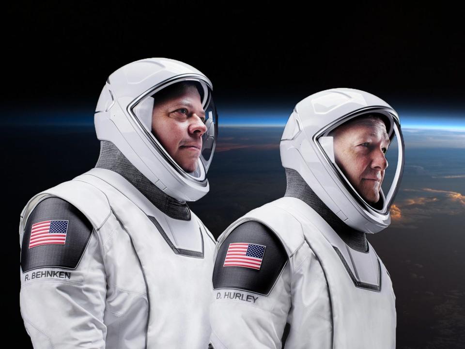 nasa astronauts bob behnken doug hurley spacex crew dragon spacesuits demo2 demo 2 earth background