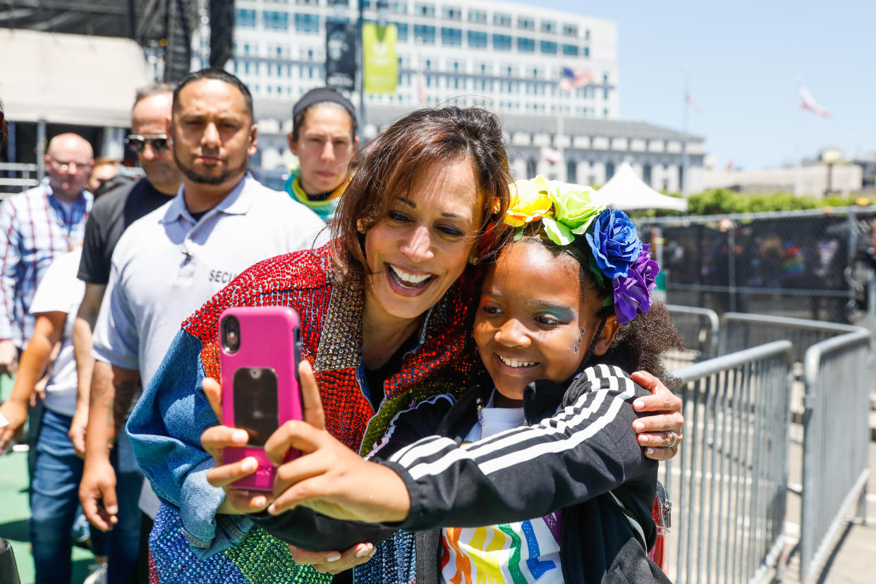 Senator Kamala Harris takes a selfie with a young girl after participating in the annual Pride Parade in San Francisco, California, on Sunday, June 30, 2019. (Gabrielle Lurie/The San Francisco Chronicle via Getty Images)