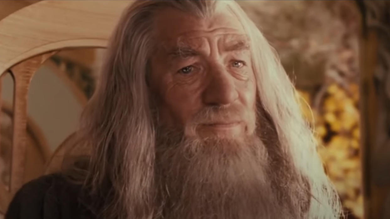  Ian McKellen sits in Rivendell with a concerned look on his face in The Lord of the Rings: The Fellowship of the Ring. 