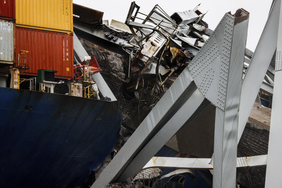 Wreckage of the Francis Scott Key Bridge rests on the container ship Dali, Wednesday, April 3, 2024, in Baltimore. (AP Photo/Julia Nikhinson)