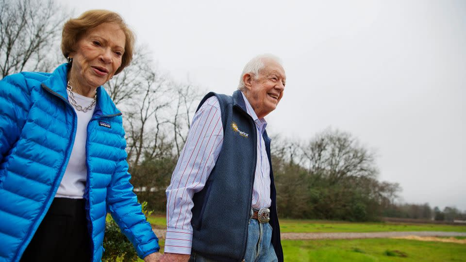 In this Feb. 8, 2017 file photo, former President Jimmy Carter (R) and his wife Rosalynn arrive at a groundbreaking ceremony for a solar panel project on farmland they own in their hometown of Plains.  -David Goldman/AP