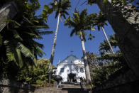 Visitors take a guided tour of Roberto Burle Marx’s former home, which was elected today as a World Heritage Site by the United Nations Educational, Scientific and Cultural Organization, UNESCO, in Rio de Janeiro, Brazil, Tuesday, July 27, 2021. The site features more than 3,500 species of plants native to Rio and is considered a laboratory for botanical and landscape experimentation. (AP Photo/Bruna Prado)