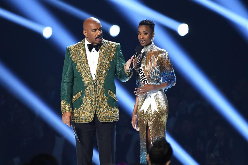 Steve Harvey and Miss South Africa Zozibini Tunzi speak onstage at the 2019 Miss Universe Pageant at Tyler Perry Studios on Dec. 8, 2019 in Atlanta, Georgia.