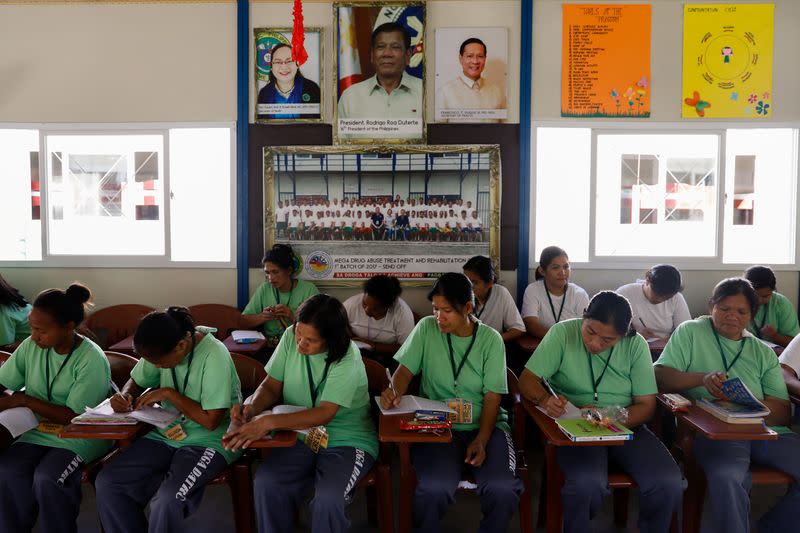 Drug rehab patients write on their journals at the Mega Drug Abuse Treatment and Rehabilitation Center, in Nueva Ecija province