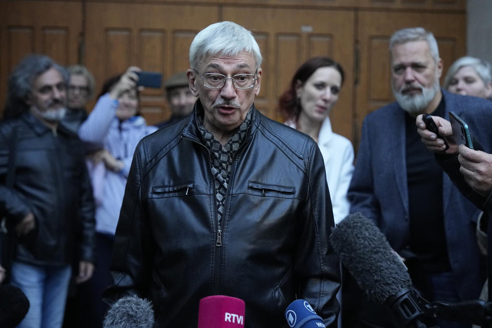 Oleg Orlov, a member of the Board of the International Historical Educational Charitable and Human Rights Society 'Memorial' (International Memorial) speaks to journalists after a court session in Moscow, Russia, Wednesday, Oct. 11, 2023. The court ordered Orlov, co-chair of the Nobel Peace Prize-winning human rights group Memorial, to pay a fine of nearly $1,500 on the charges of "discrediting" the Russian military in his criticism of Russia's campaign in Ukraine. (AP Photo/Alexander Zemlianichenko)