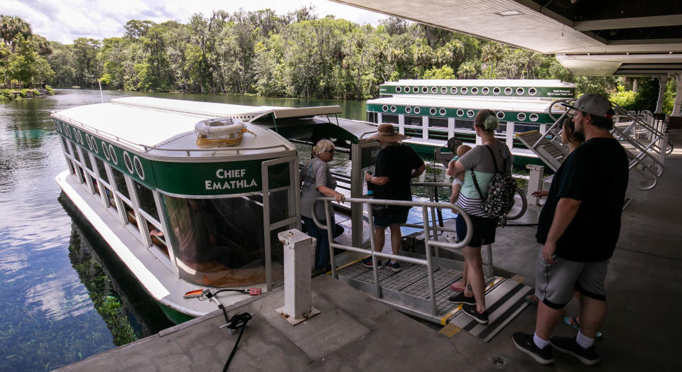 Tourists load the glass bottom boat Chief Emathla for a tour of the Silver River. People, mostly from the state of Florida, were visiting Silver Springs State Park to kayak, hike or sightsee on the glass-bottom boats on June 6.