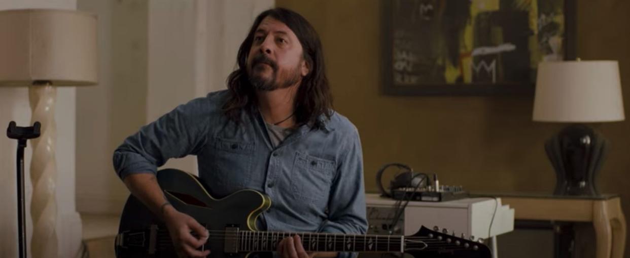 dave grohl plays the guitar in a scene from studio 666