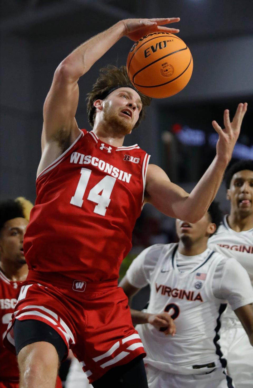 Wisconsin forward Carter Gilmore grabs a rebound. The University of Wisconsin Badgers mens basketball team defeated the University of Virginia Cavaliers as they faced off in the 2023 Fort Myers Tip-Off tournament Monday, November 20, 2023. The Badgers won with a final score of 65-41.